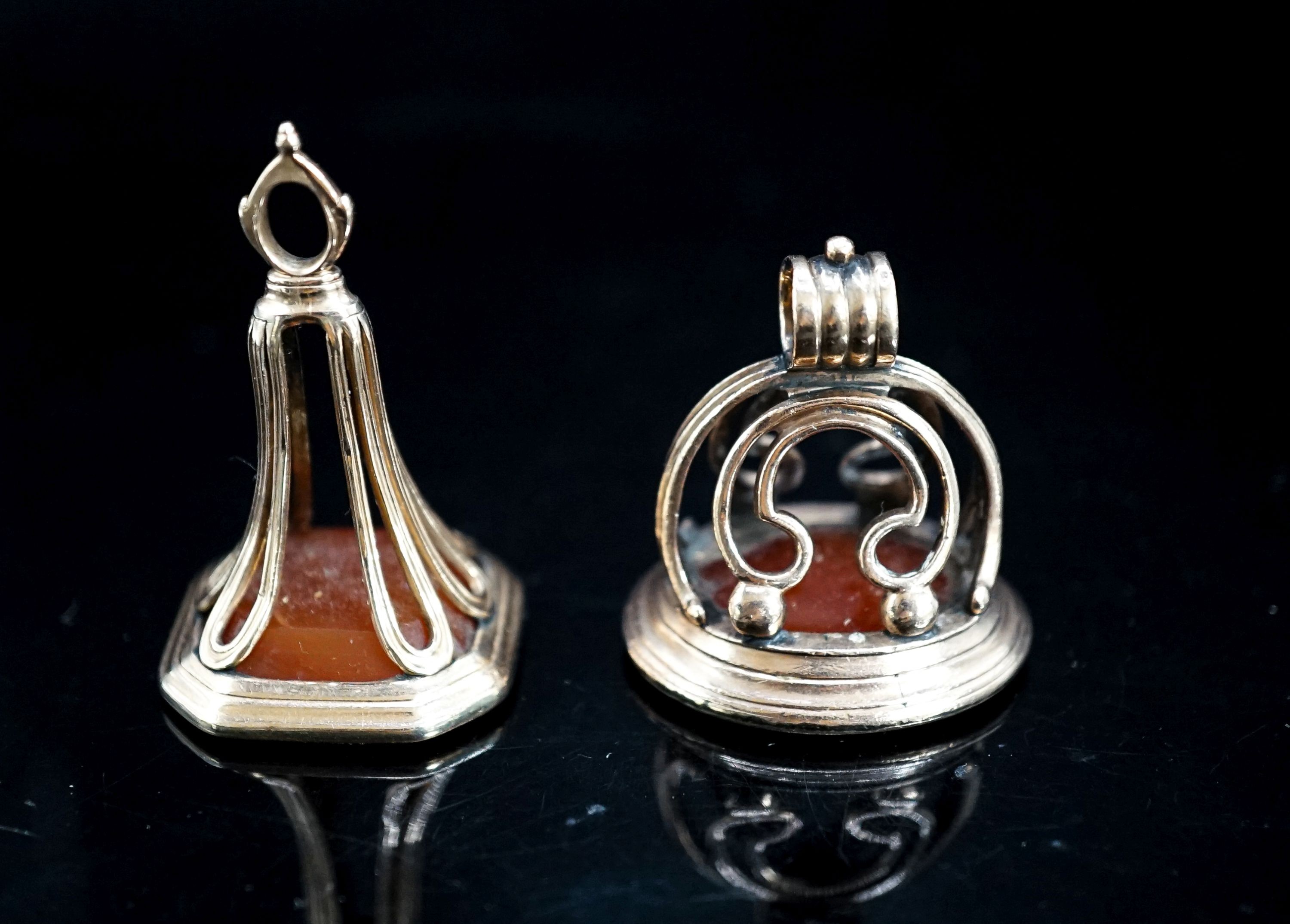 Two 19th century yellow metal overlaid and carnelian set fob seals, largest 43mm.